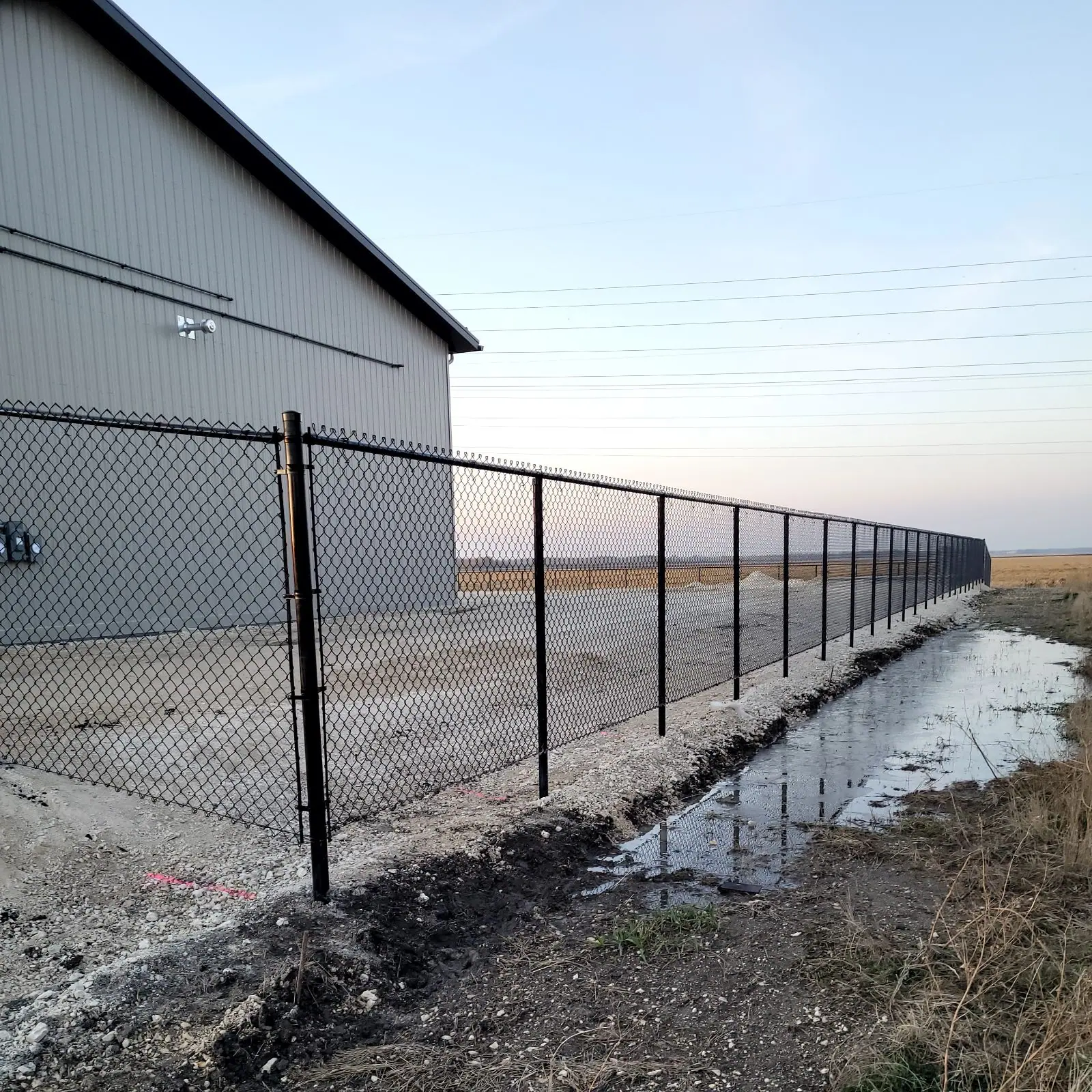 Black chainlink fence at a commercial property