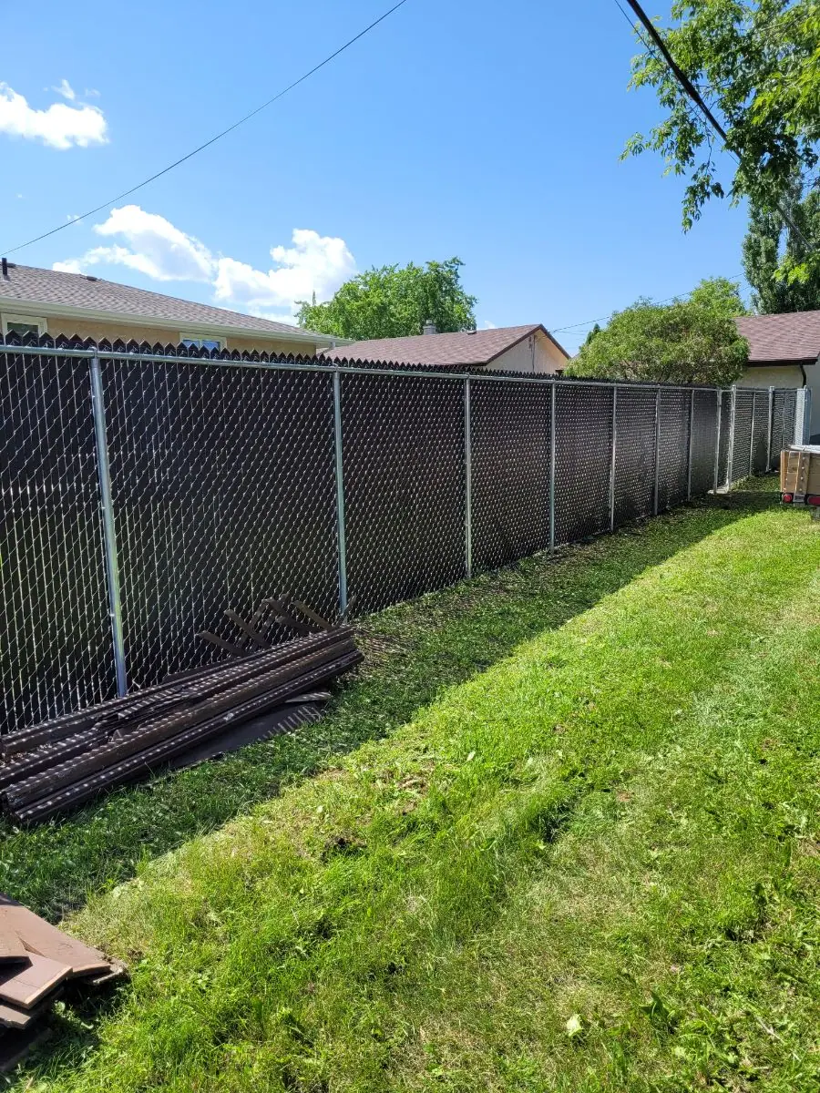 Chainlink fence with black privacy inserts