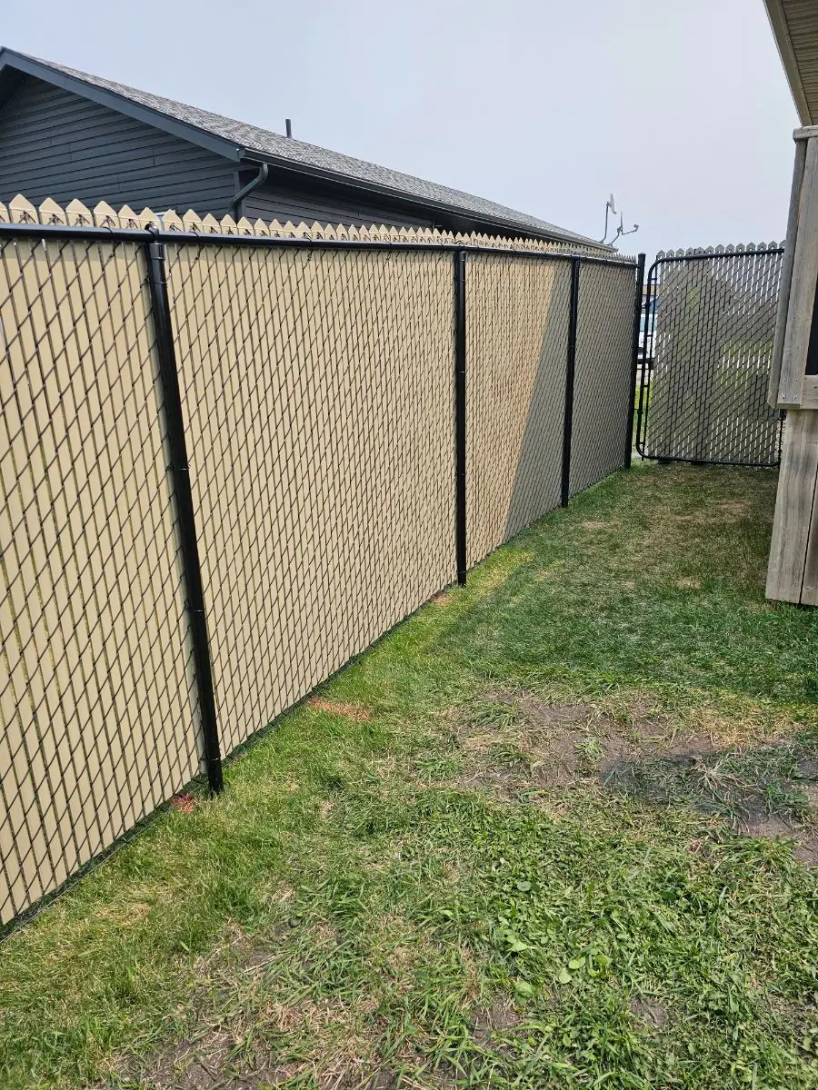 Chainlink fence with tan privacy inserts