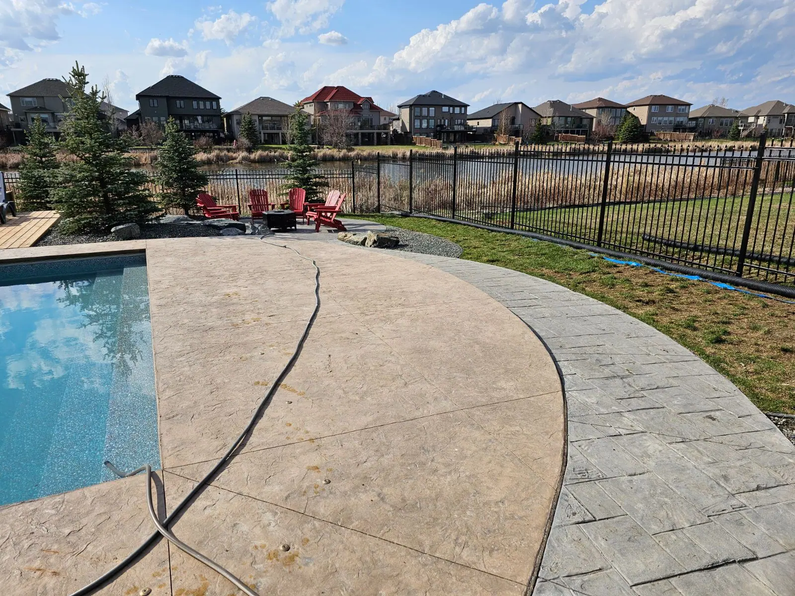 Ornamental steel fence around a pool